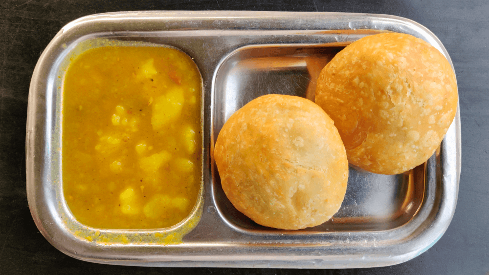 Kachori with Aloo Sabji (Spiced Lentil-Filled Pastry with Potato Curry)